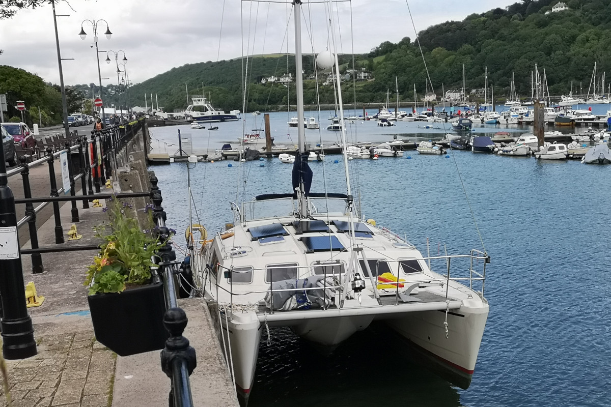 Catamaran Solaris Sunrise 36 - alongside the town wall, Dartmouth.  Good view of the 4 solarpanels we fitted on the coachroof which keep our batteries topped up all year round